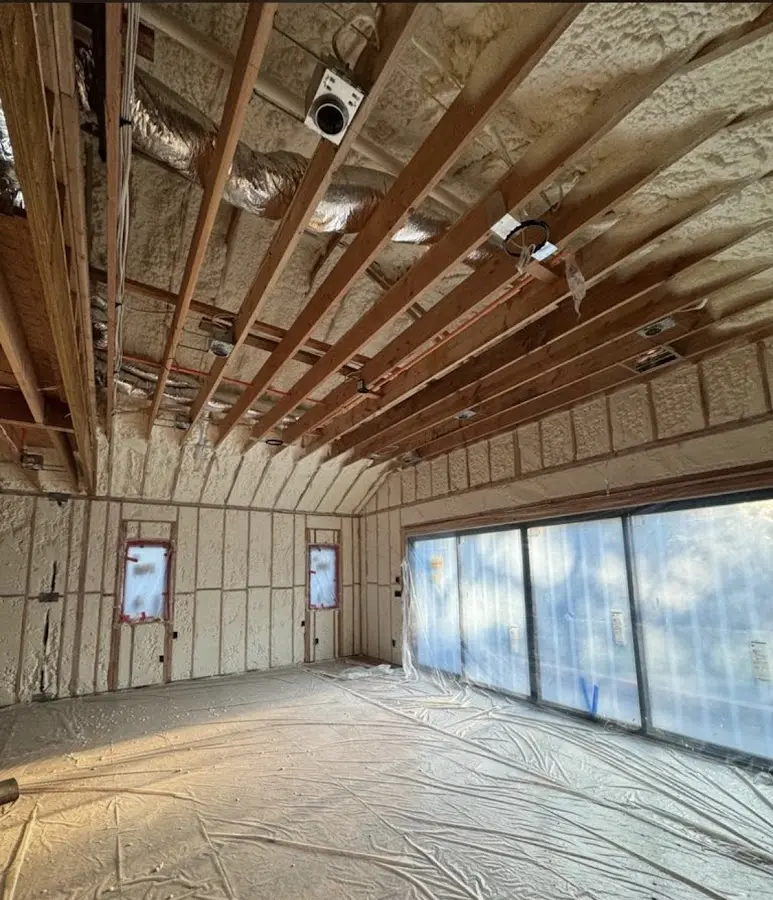 Interior walls and ceiling insulated with spray foam during new construction in North Hobbs